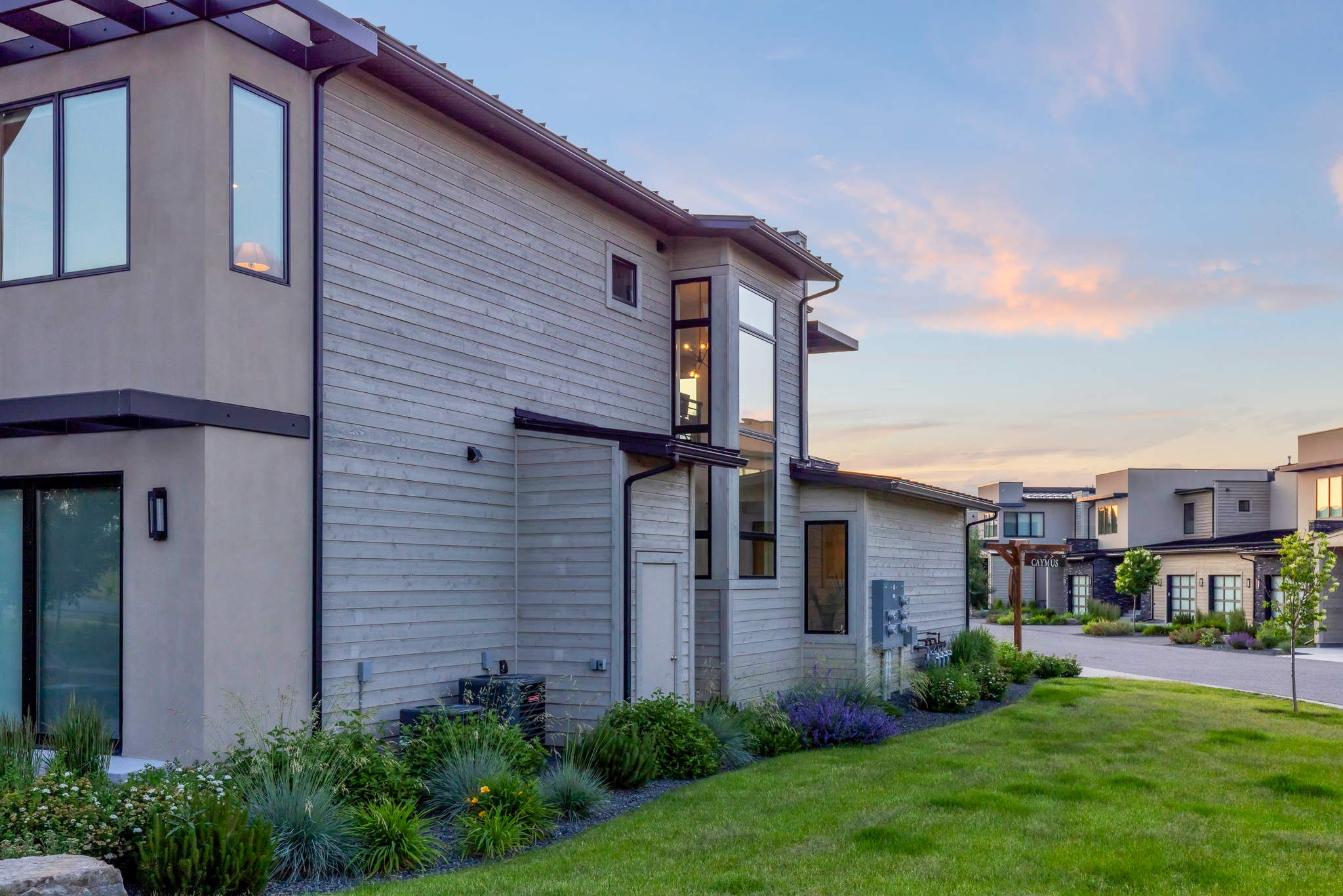 Multiple condominium buildings in Bozeman showing roofs siding gutters and exterior components