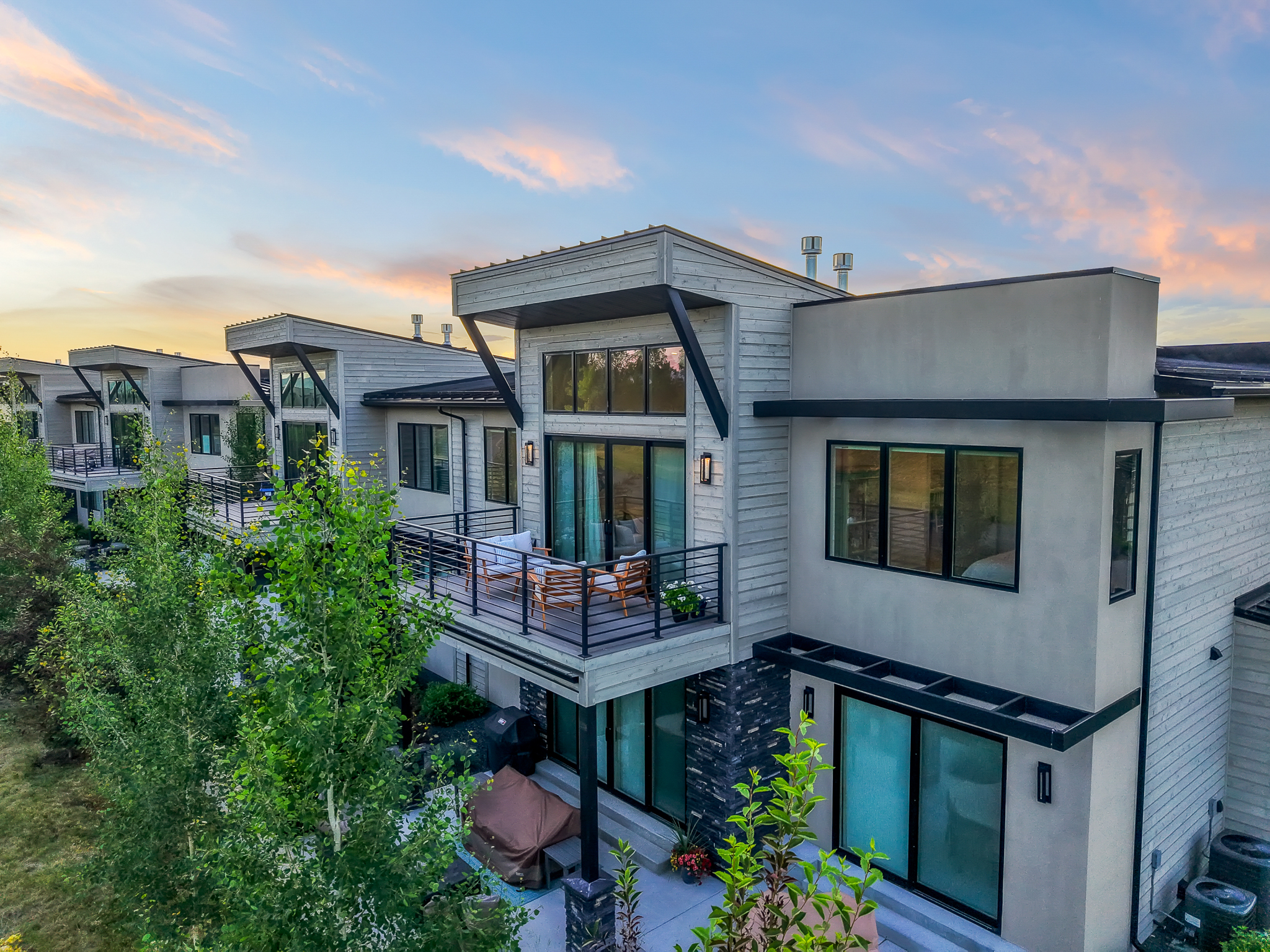 Garage doors windows patios and walkways at a Bozeman condominium development